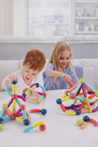 Kids playing with magnetic sticks toy