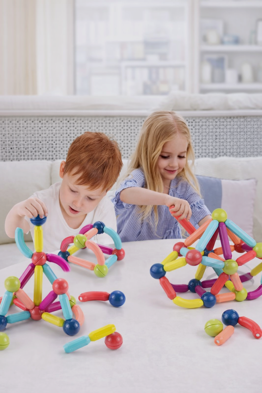 Kids playing with magnetic sticks toy